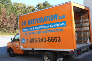Fire Damage Restoration Truck At Job Site